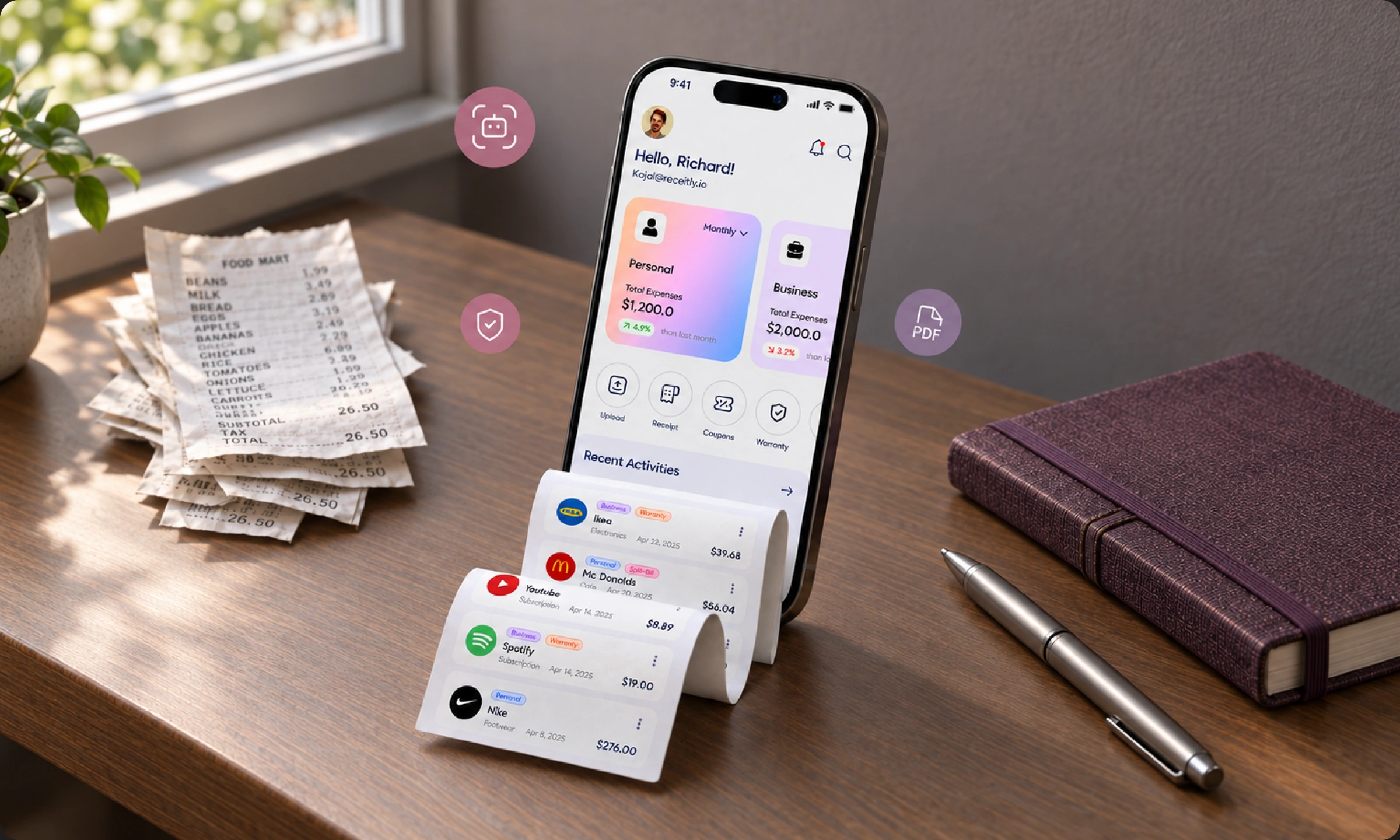 Receitly mobile expense dashboard on a desk beside receipts and stationery