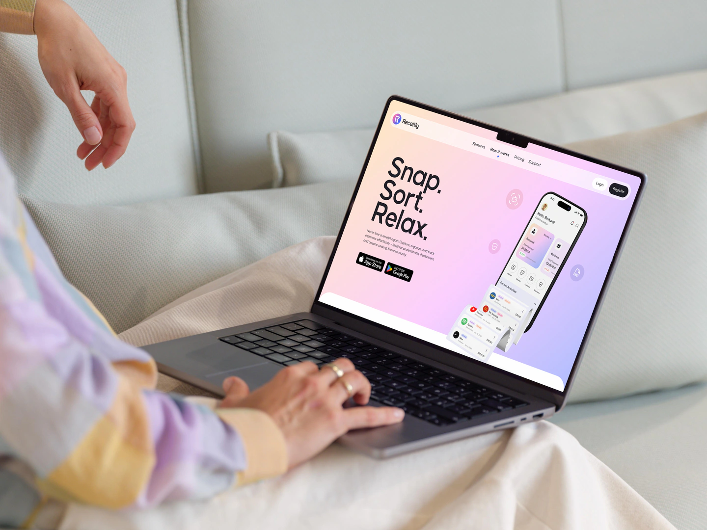 Website displayed on a laptop on a modern sofa